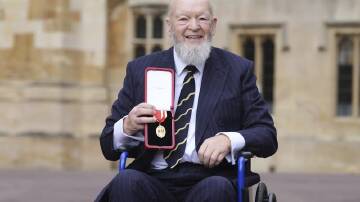 Glastonbury founder Sir Michael Eavis remembered his royal visitors as he was knighted in Windsor. (AP PHOTO)